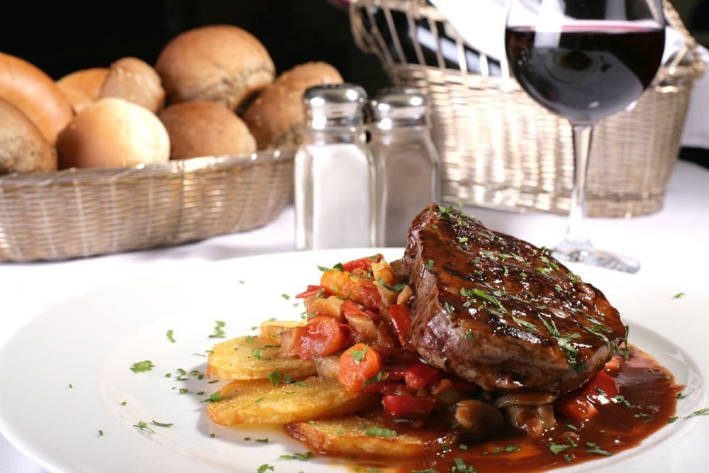 Some people who couldn't afford a fine steak dinner with wine (pictured) wonder 'is dine and dash illegal'