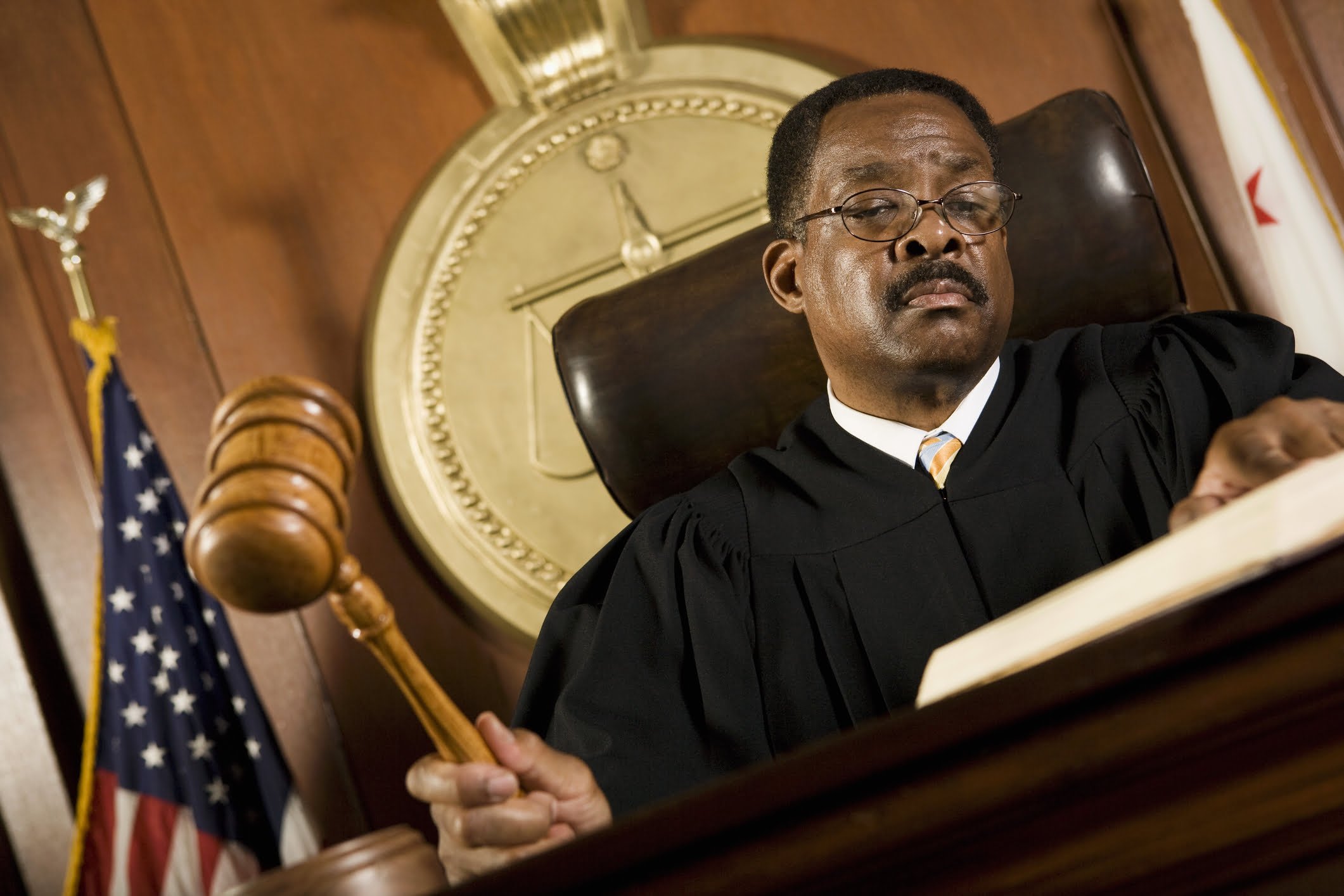 A judge holds a gavel while determining on a criminal sentence, but how does he decide?