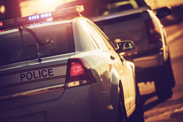 A police vehicle using a pretext stop to pull over a truck