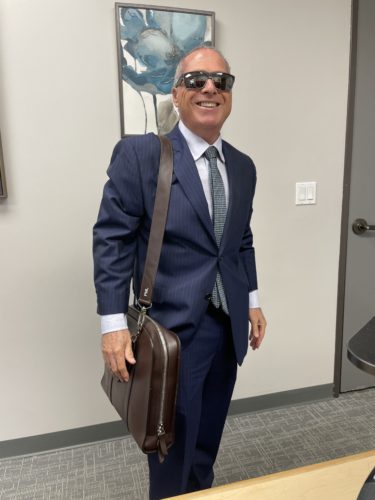 Peter Liss Earns AVVO Client Choice Award 1 Peter Liss carrying a briefcase.